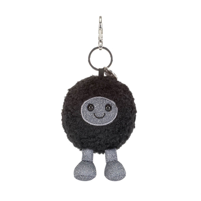 Black hole plush keychain with a smiling face on a white background