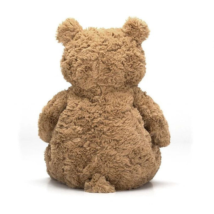 Rear view of a brown plush bear on a white background