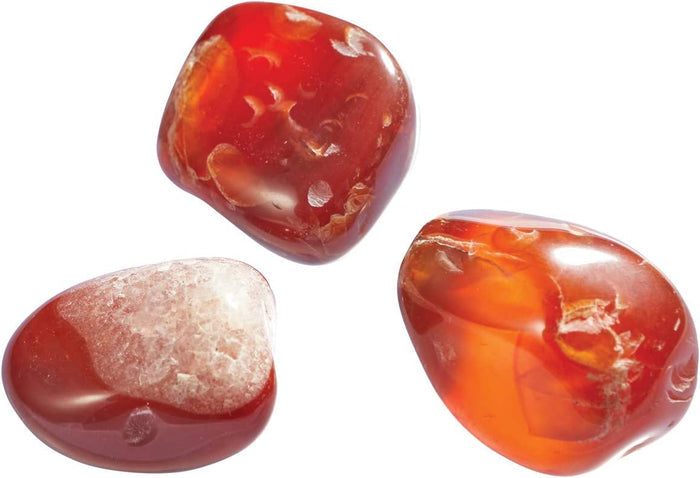 Three amber gems on a white background.