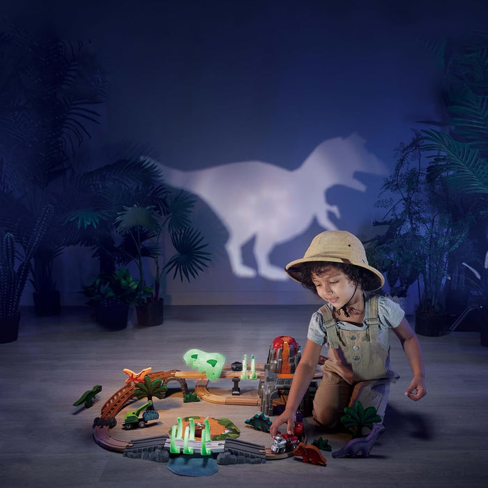 Child playing with toy cars on a dark background with a projected horse silhouette
