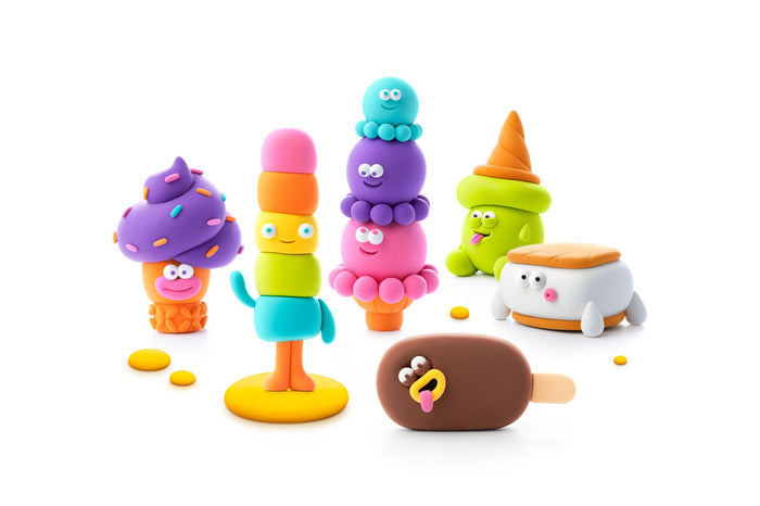 Colorful ice cream-themed figurines on a white background