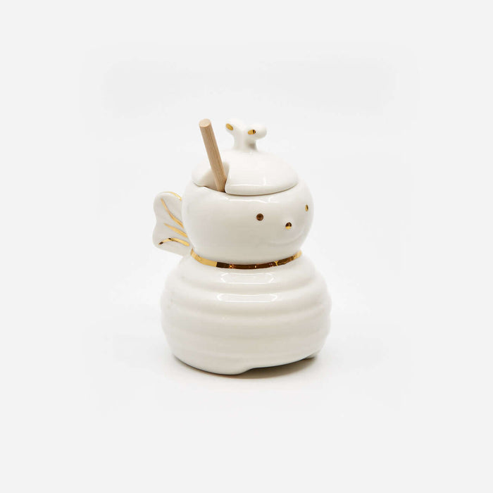Honey Bee Jar w/Dipper, porcelain honey jar shaped like a bee with gold accents and wooden dipper.