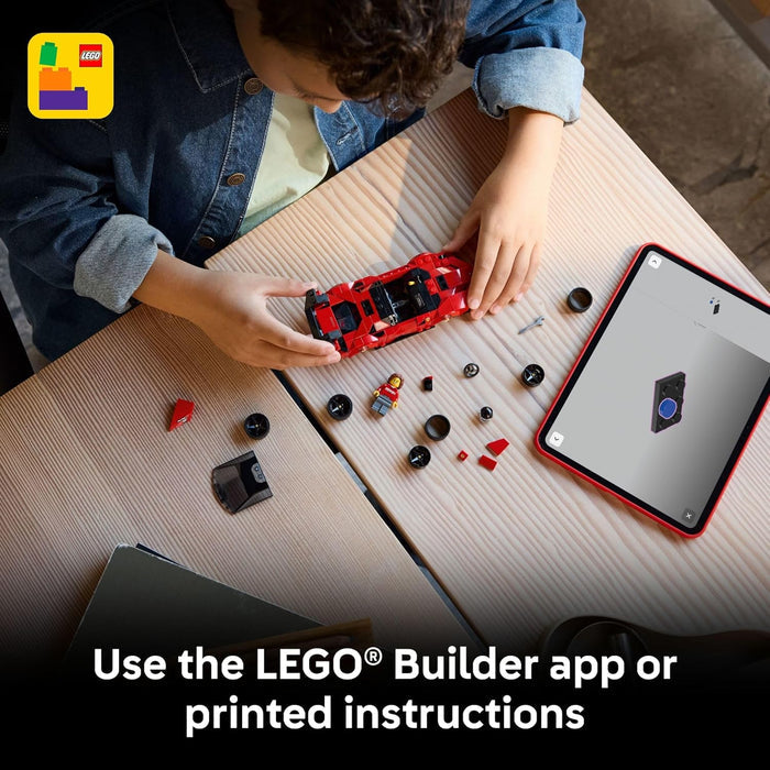 Child playing with LEGO bricks and using a tablet with a LEGO app on a wooden table.