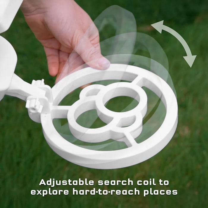 Hand holding a white adjustable search coil with grass background