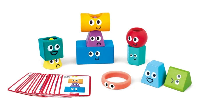 Colorful toy blocks with smiling faces on a white background