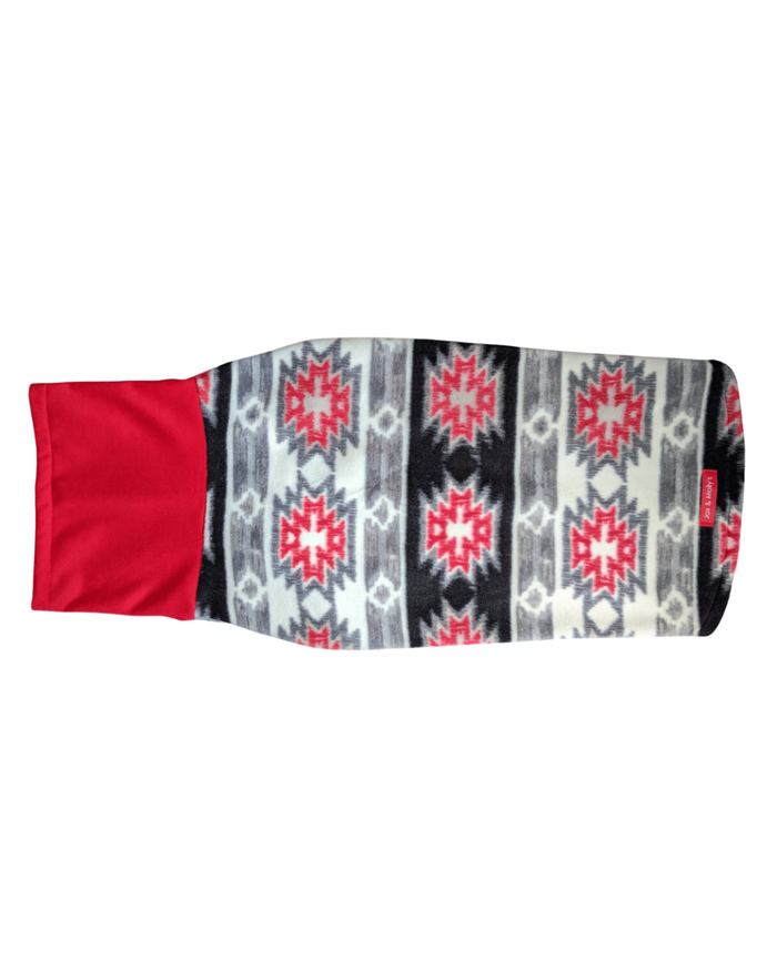Back profile of Jax & Molly's Aztec fleece dog sweater in red, gray, white, and black colors and paired with a red sweatshirt turtleneck.
