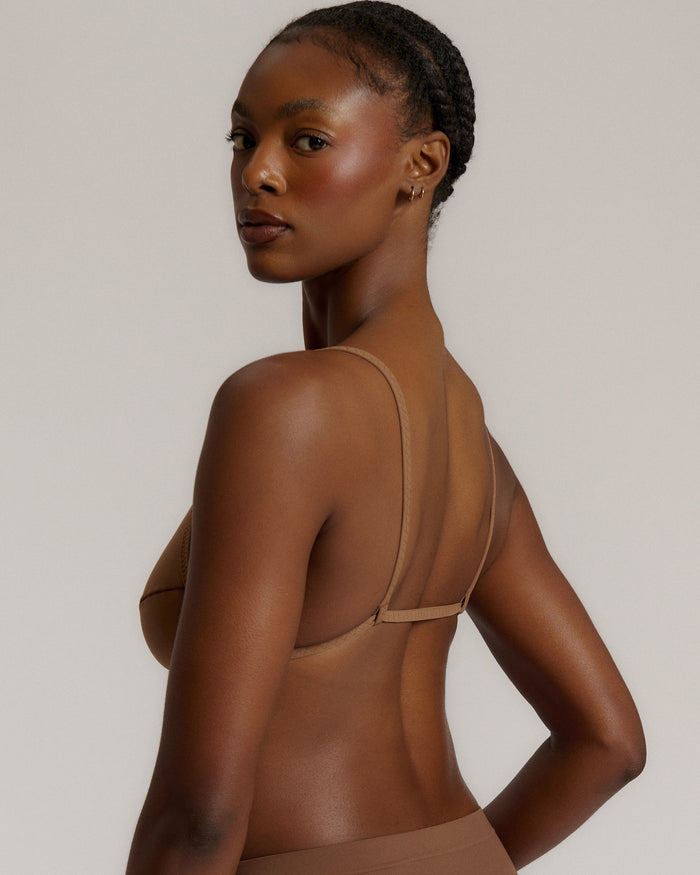 A woman wearing a brownz scoop system and matching bottoms