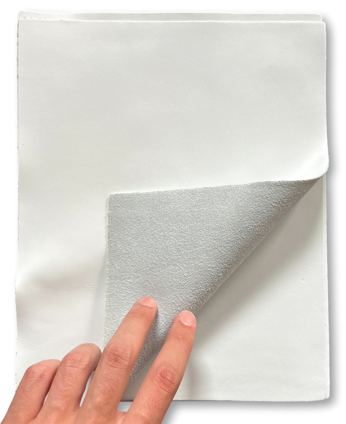 Close-up of White Smooth Cowhide Sheets, 8.5 × 11 in showing grain, texture, and finish