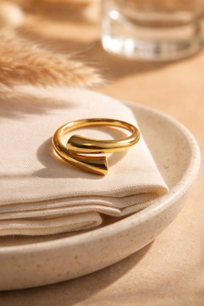 polished gold adjustable open cuff ring 18k pvd plated stainless steel styled on linen cloth and ceramic plate
