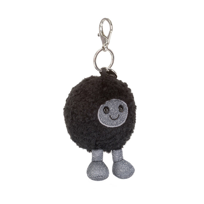 Black hole plush keychain with a smiling face on a white background