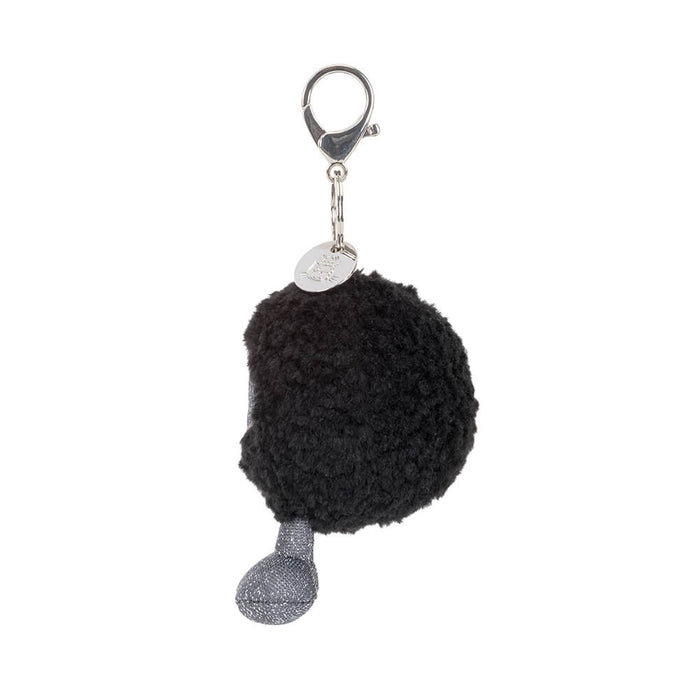 Black hole keychain with a silver tag on a white background