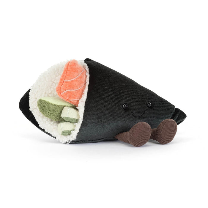 Stuffed toy resembling a sushi roll with black exterior, orange and green fillings on a white background