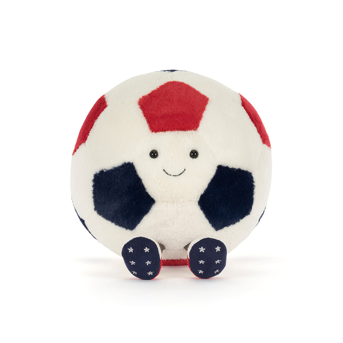 Plush toy soccer ball with a smiling face on a white background
