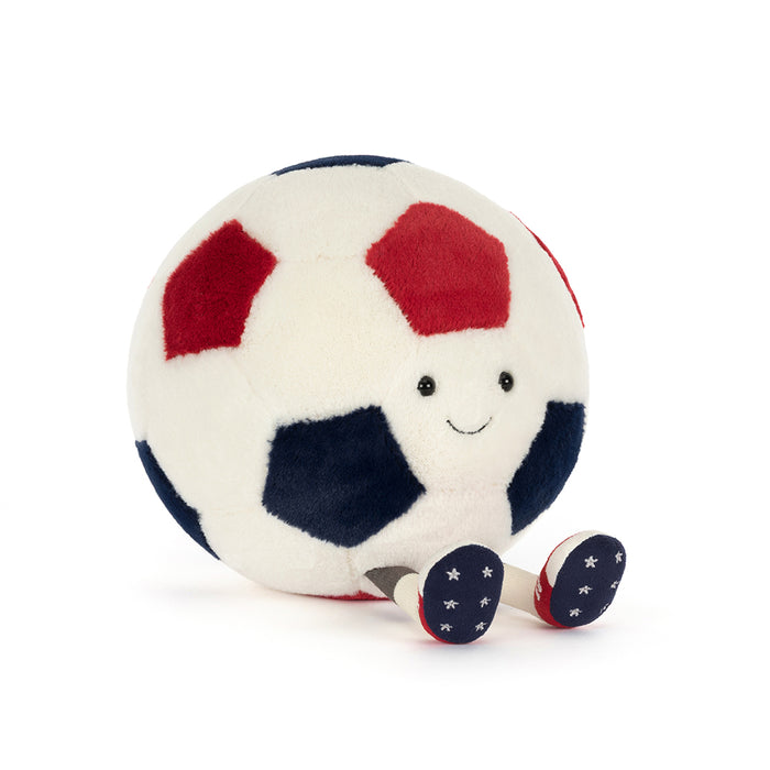 Plush toy soccer ball with a smiling face on a white background