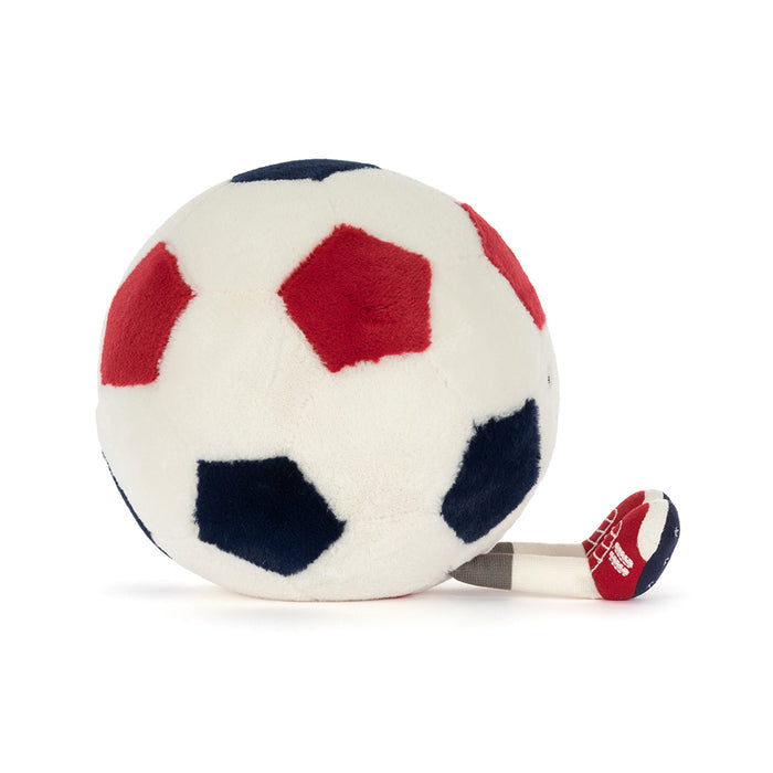 Plush toy shaped like a soccer ball with red, white, and blue colors on a white background