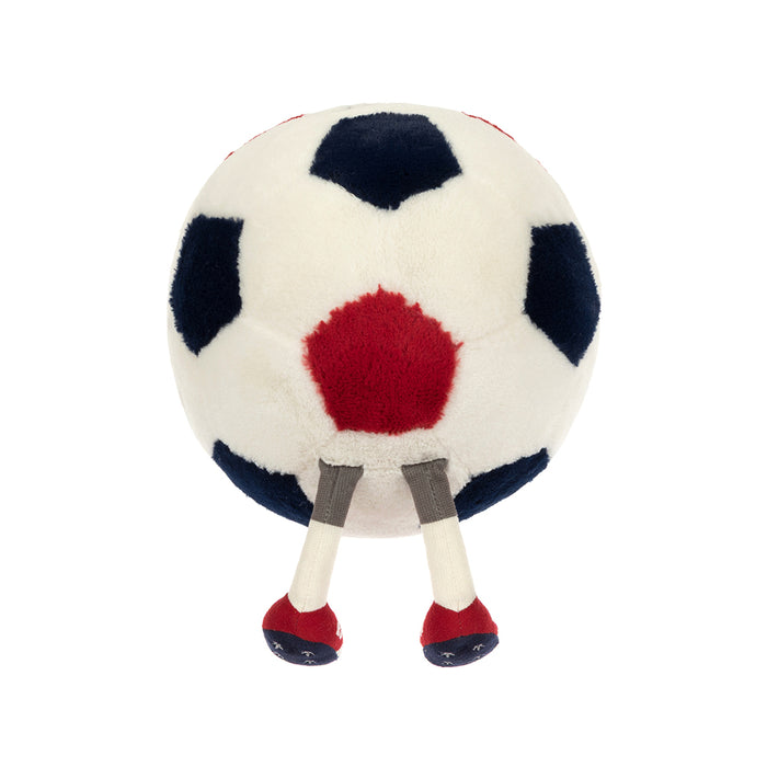 Plush toy resembling a soccer ball with red center, blue and white sections, and red and black shoes on a white background.