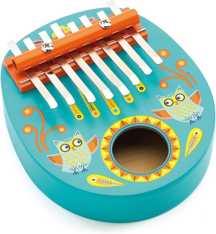 Children's musical instrument with owl design on a white background