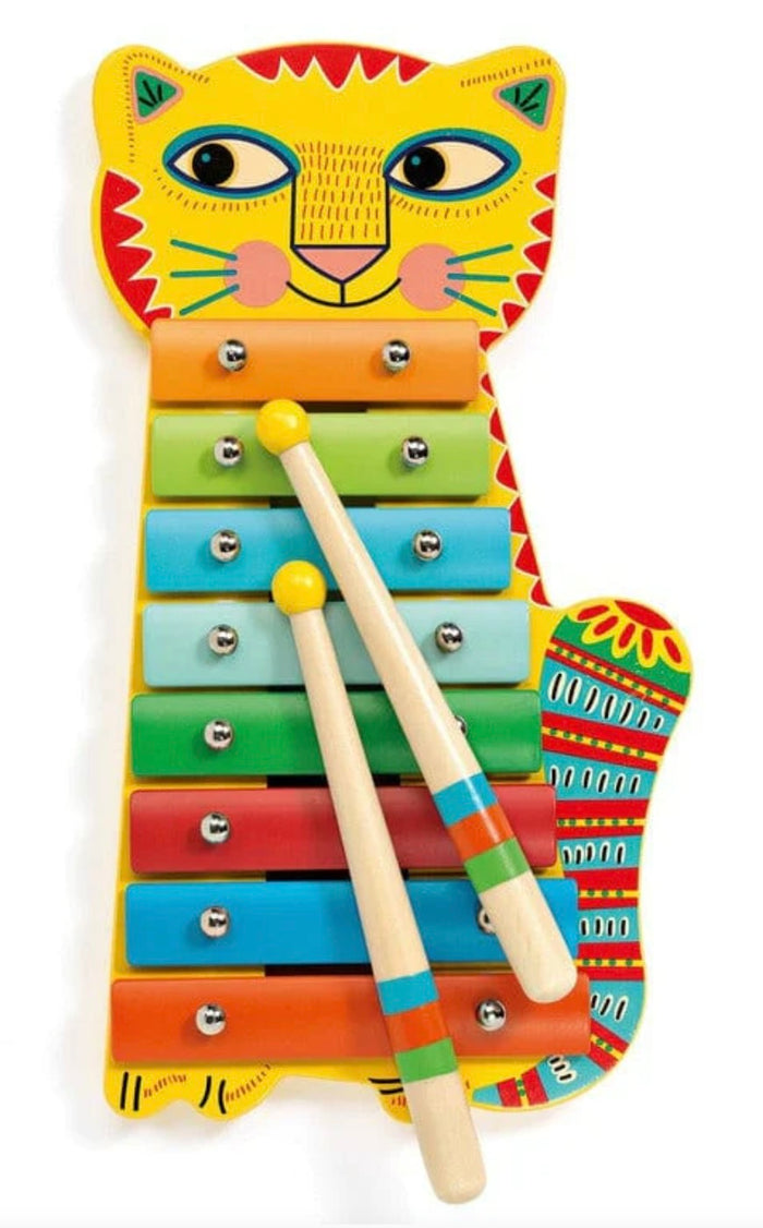 Colorful children's xylophone with a cat face and drumsticks on a white background