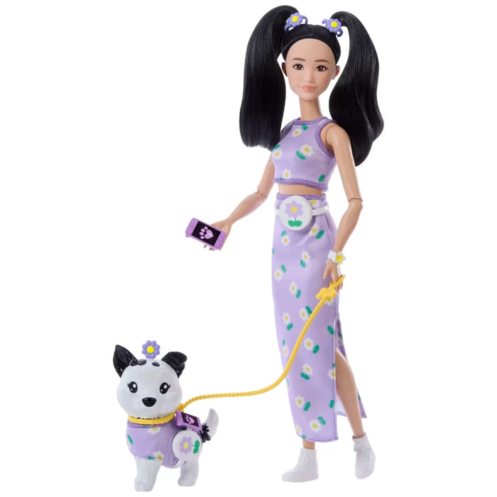 Doll and dog toy set with matching purple outfits on a white background