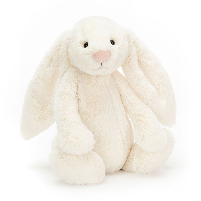 Cream-colored bunny plush toy on a white background