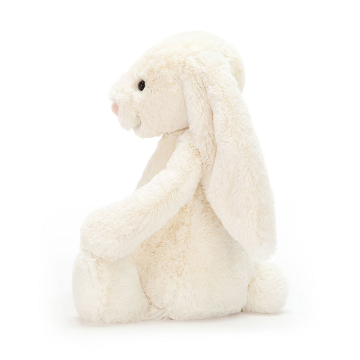 White plush bunny toy on a white background