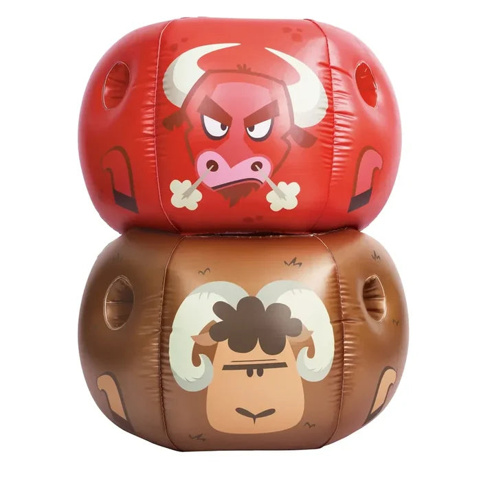 Two inflatable themed bumper balls stacked vertically on a white background. The top bag is red with a cartoon angry bull face, and the bottom bag is brown with a cartoon serious ram face.