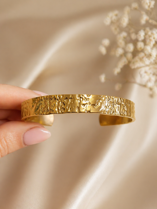 hammered gold stainless steel cuff bracelet textured finish open bangle close-up hand