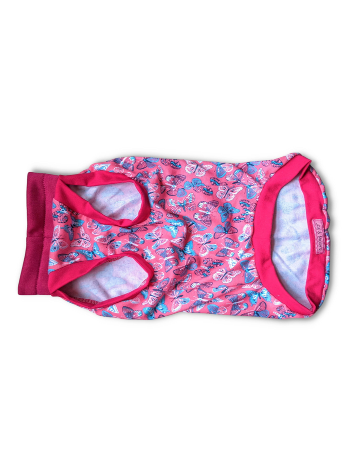 Bubblegum Butterfly cotton-spandex dog pajamas flat lay side view showing leg opening, Jax & Molly’s