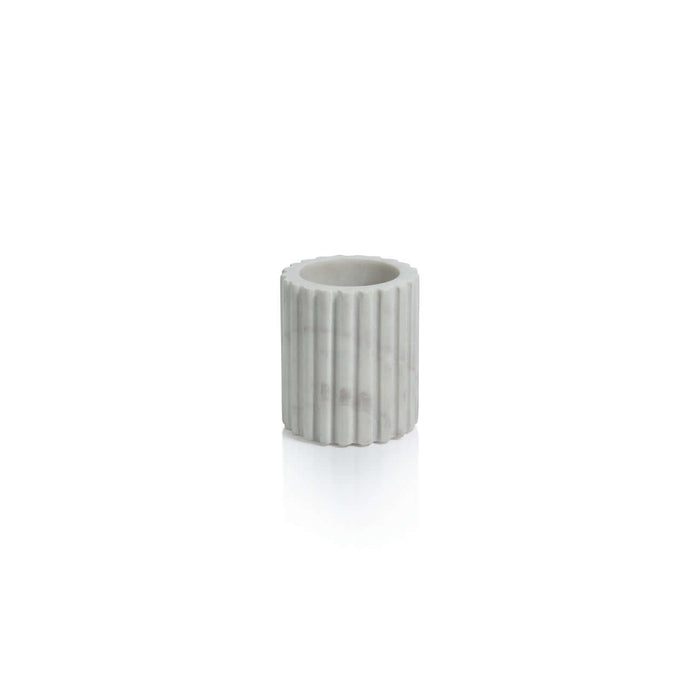 Camogli Bath Collection tumbler made of solid white marble with vertical fluting design.