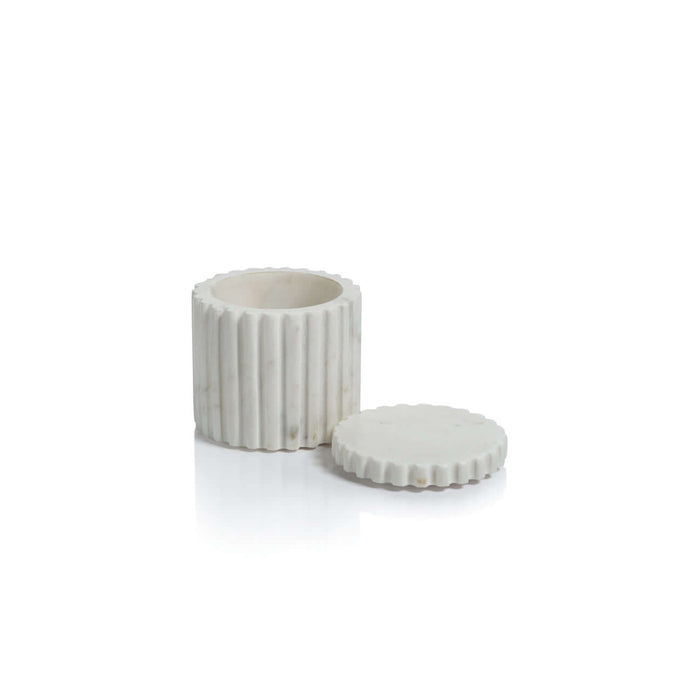 Canister with Lid from the Camogli Bath Collection, crafted in solid white marble with vertical fluting and natural veining.