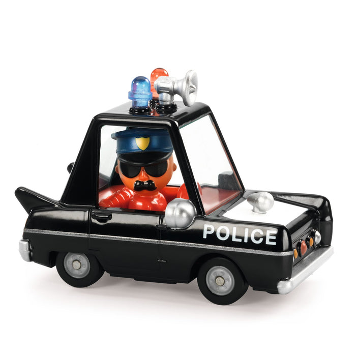A miniature toy police car with black and grey body, and a rotating police figure as the driver.