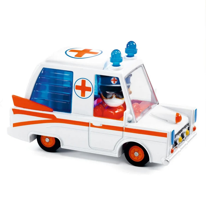A miniature toy Ambulance with white and red body, and a rotating figure as the driver.