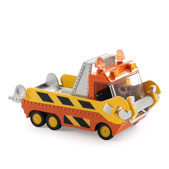 A miniature toy flat bed truck with orange and yellow body, a silve flat bed, and a rotating figure as the driver.