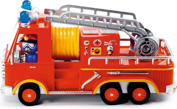 A miniature toy fire engine with red and yellow body, a silver ladder, and a rotating figure as the driver.