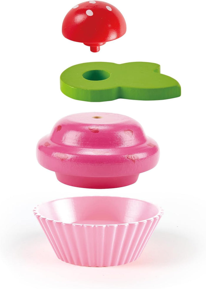 Pink bowl with a green lid and red top on a white background