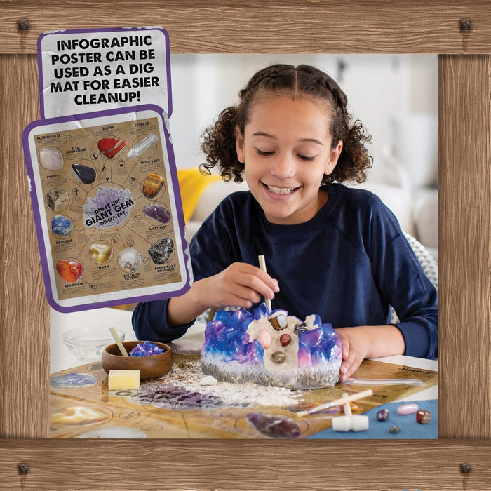 Child crafting with a gem-themed activity mat and poster on a wooden surface.