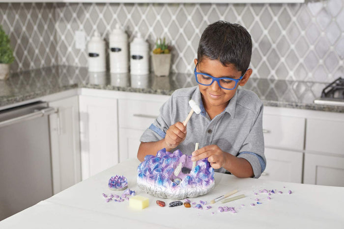 Boy playing with Giant Gem in a kitchen setting.
