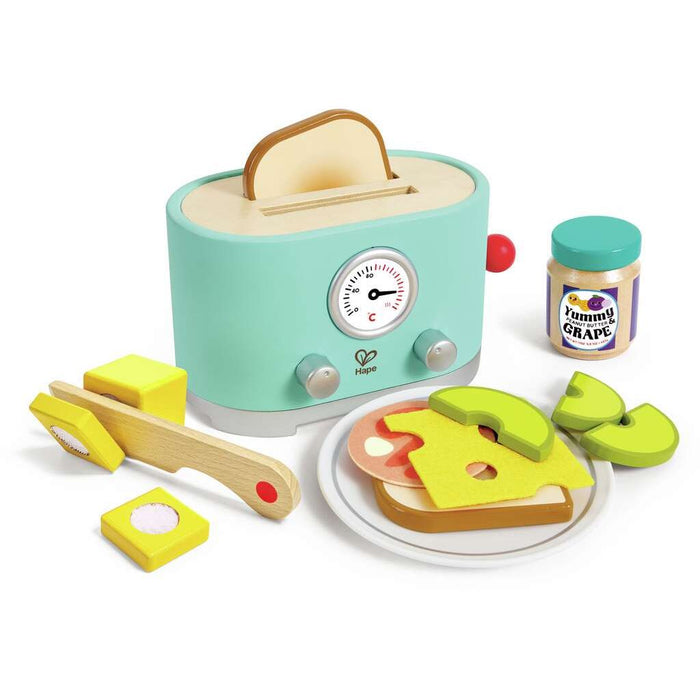 Toy toaster set with slices of bread, a jar of grape jam, and a toy knife on a white background