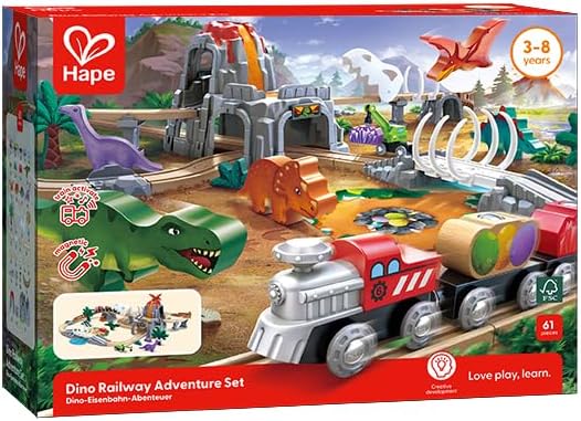 A colorful dinosaur railway adventure set with various dinosaur figures, tracks, and a train. The packaging highlights that it glows in the dark and includes 23 beech wood tracks and over 30 additional accessories.