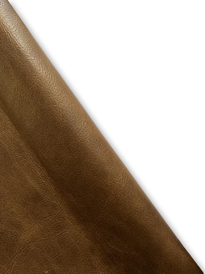 Saddle-style distressed cowhide detail view showing color and natural variation