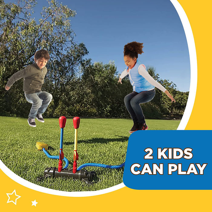 Kids playing on the grass in their backyard with Dueling Stomp Rockets.