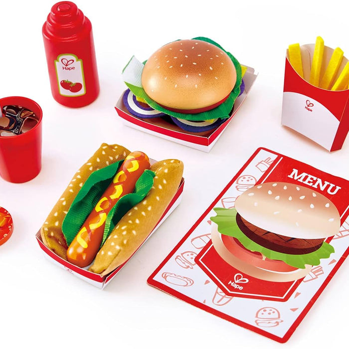 Toy food set including a hamburger, hot dog, and fries on a white background