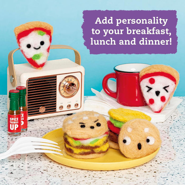 A styled tabletop scene with felt food characters: a pizza slice on a plate, a hamburger, a burger with a round bun, a red mug, small sauce bottles, and a radio. A purple text box says, 'Add personality to your breakfast, lunch and dinner!'.