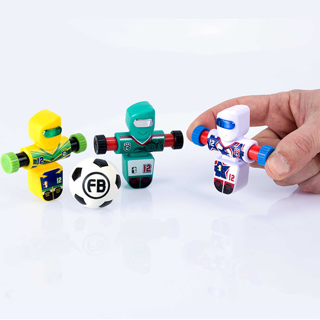 Three Foosbot toys with a soccer ball on a white background