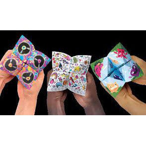 Three pairs of hands holding three uniquely designed fortune tellers against a black background