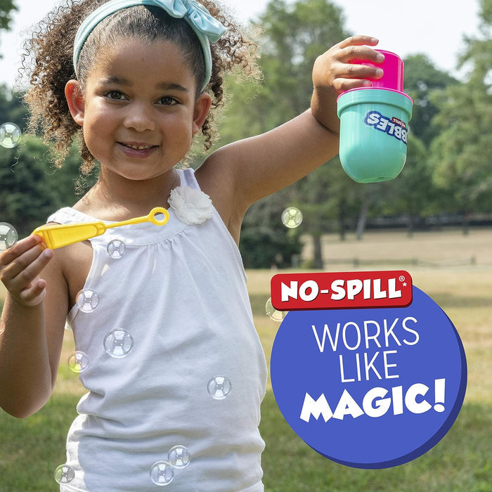 Child holding a No Spill Tumbler upside down in a park setting with the text "works like magic!"