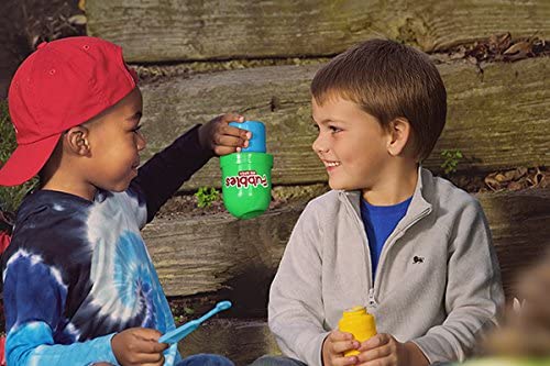 Children playing with the bubble tumbler against a wooden background