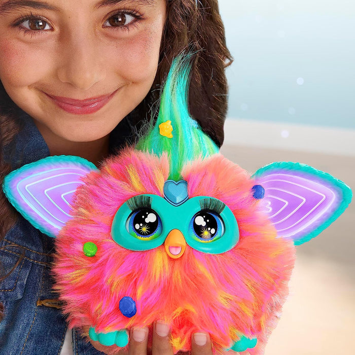 Child holding colorful Furby Toy
