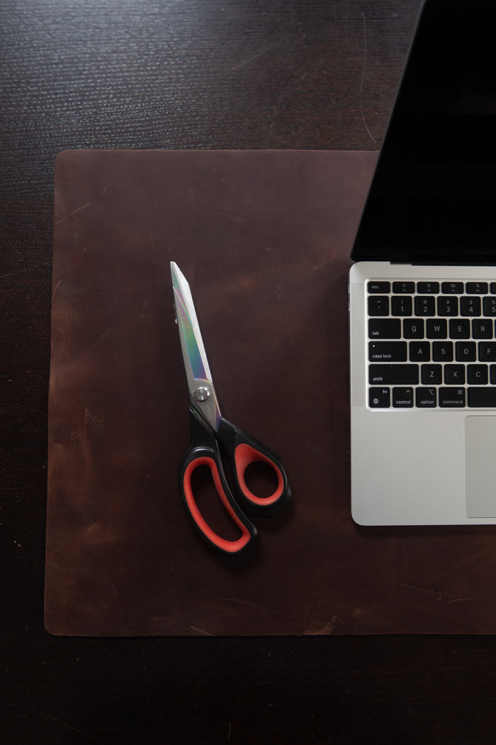 Full-Grain Leather Desk Pad, 31.5 × 15.75 in shown to display leather shape and cutting area