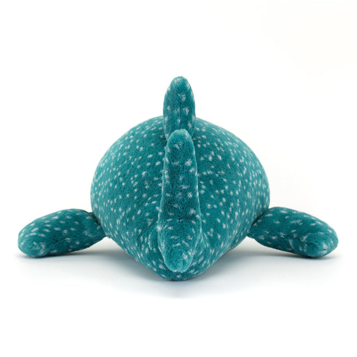 Teal plush toy with white speckles on a white background